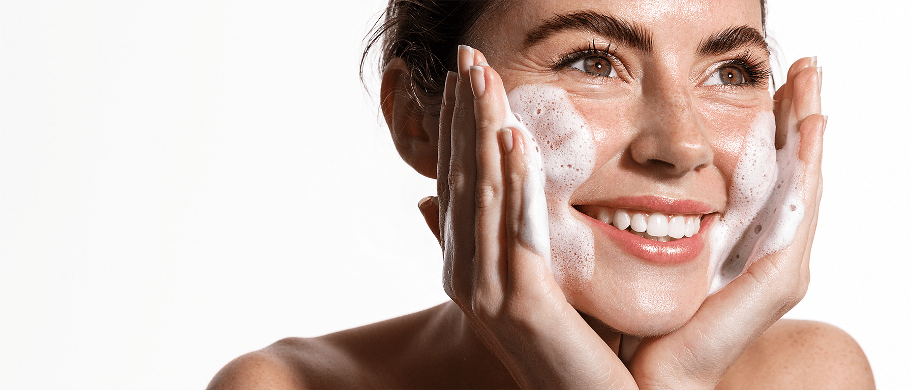 Massaging cleansing foam in the face