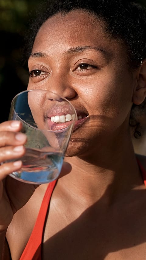 Woman drinking from a glass of water