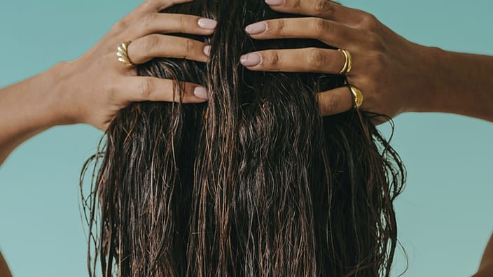 Woman massages head
