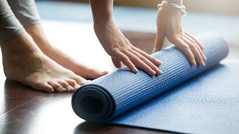 yoga mat is rolled out