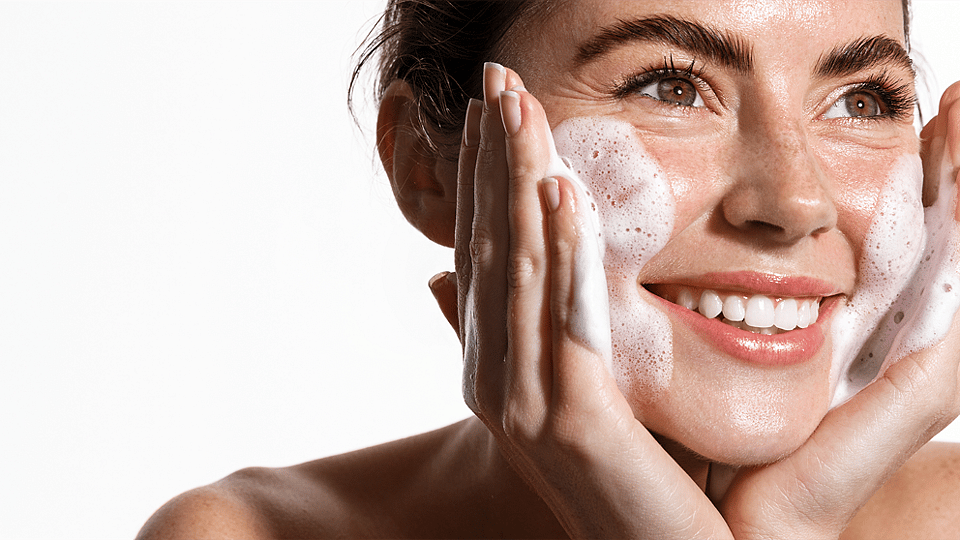 Massaging cleansing foam in the face