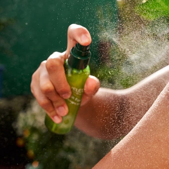 woman applying dry oil