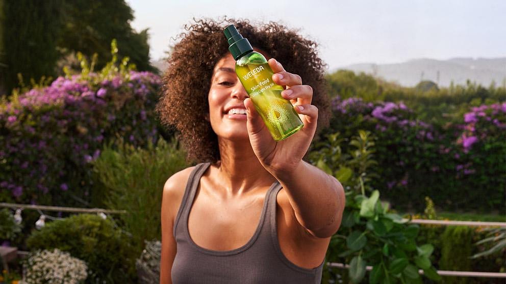 woman holding spray