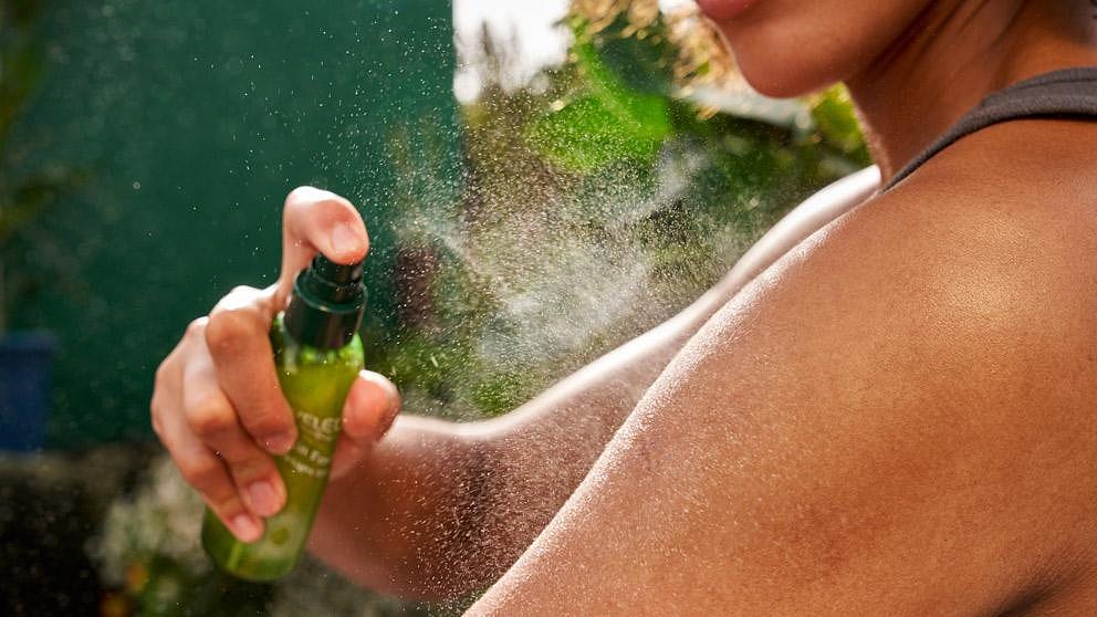 woman appyling spray