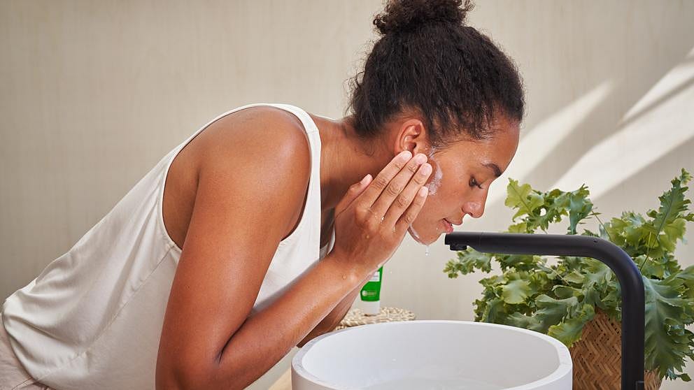 woman massaging face