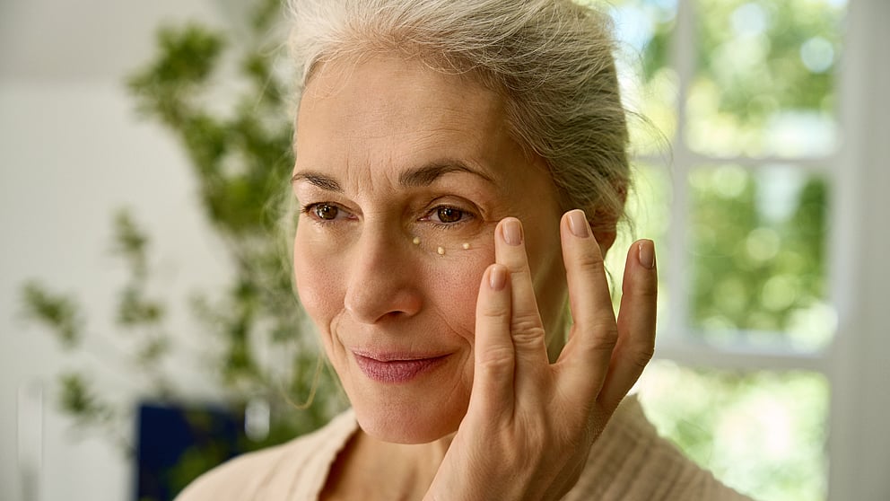 woman applying eye cream